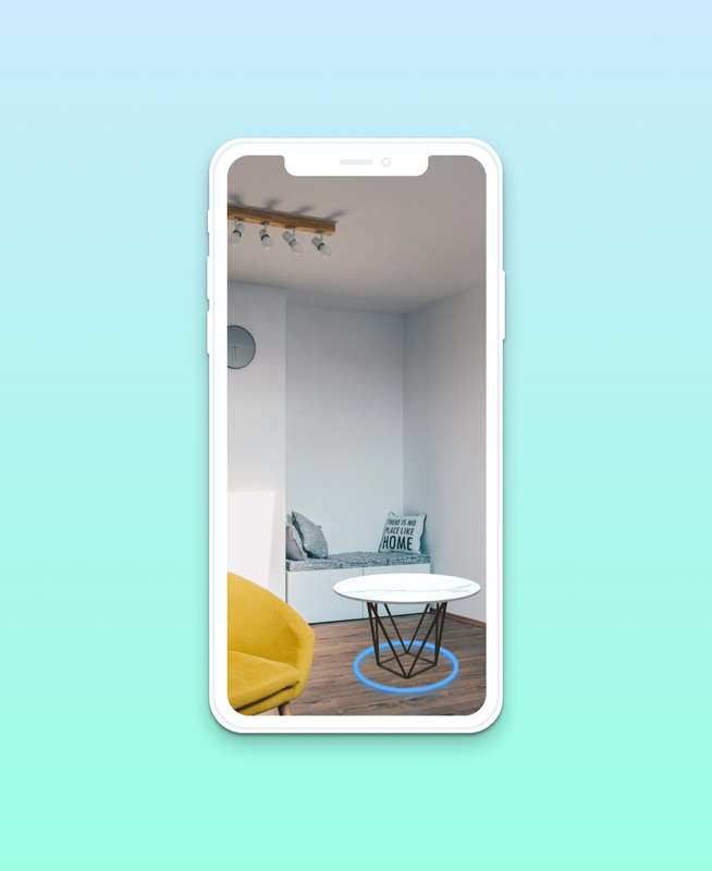 White iPhone on top of blue to green vertical gradient. Phone is depicting pass through AR technology of a modern room that includes a marble top table with blue ring around the base of the table on the floor.  Links to AR UI page.